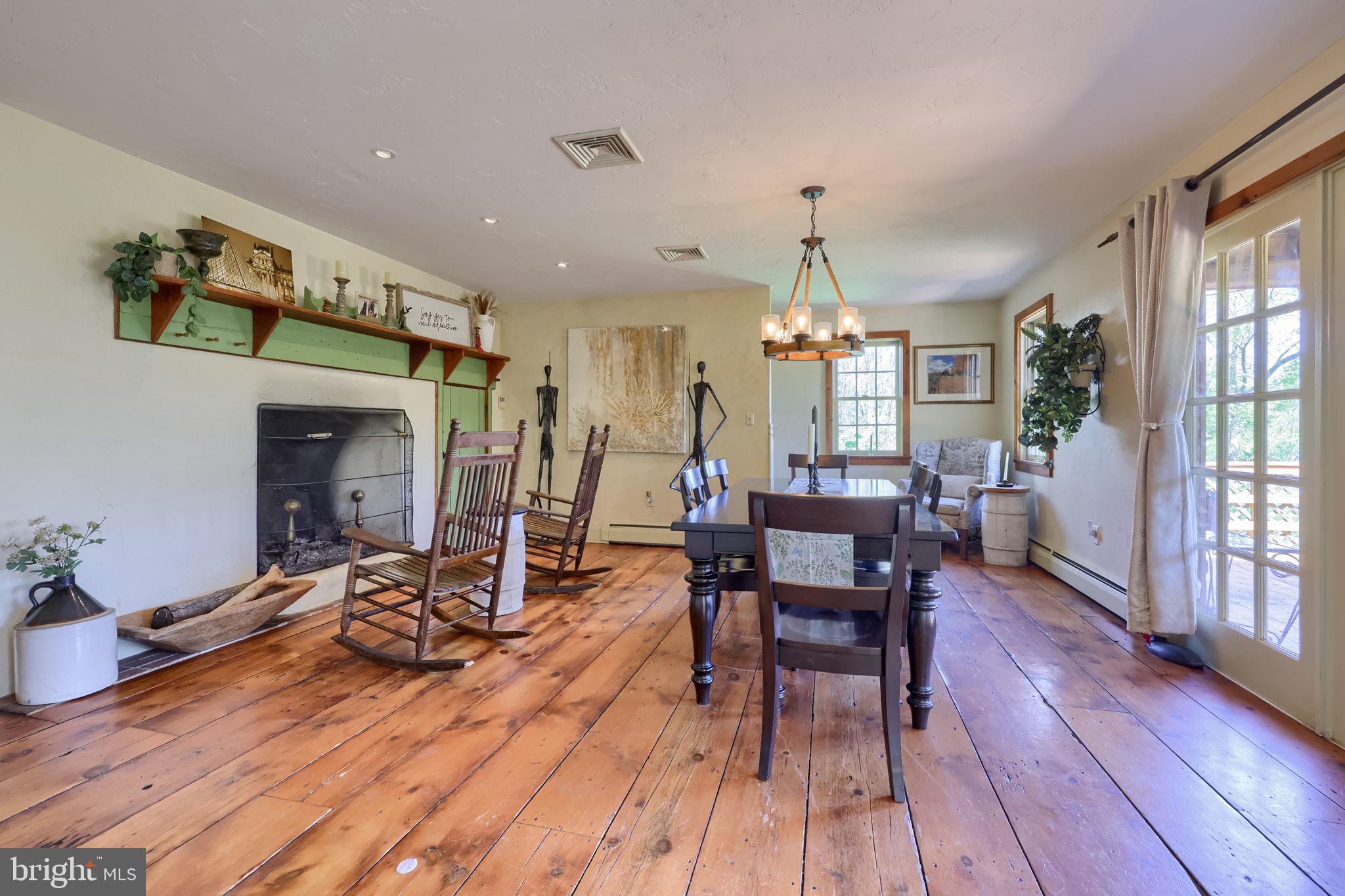 705 Schoffers Road Birdsboro, PA 19508 - Photo 47 of 106 a view of a dining room with furniture window and wooden floor