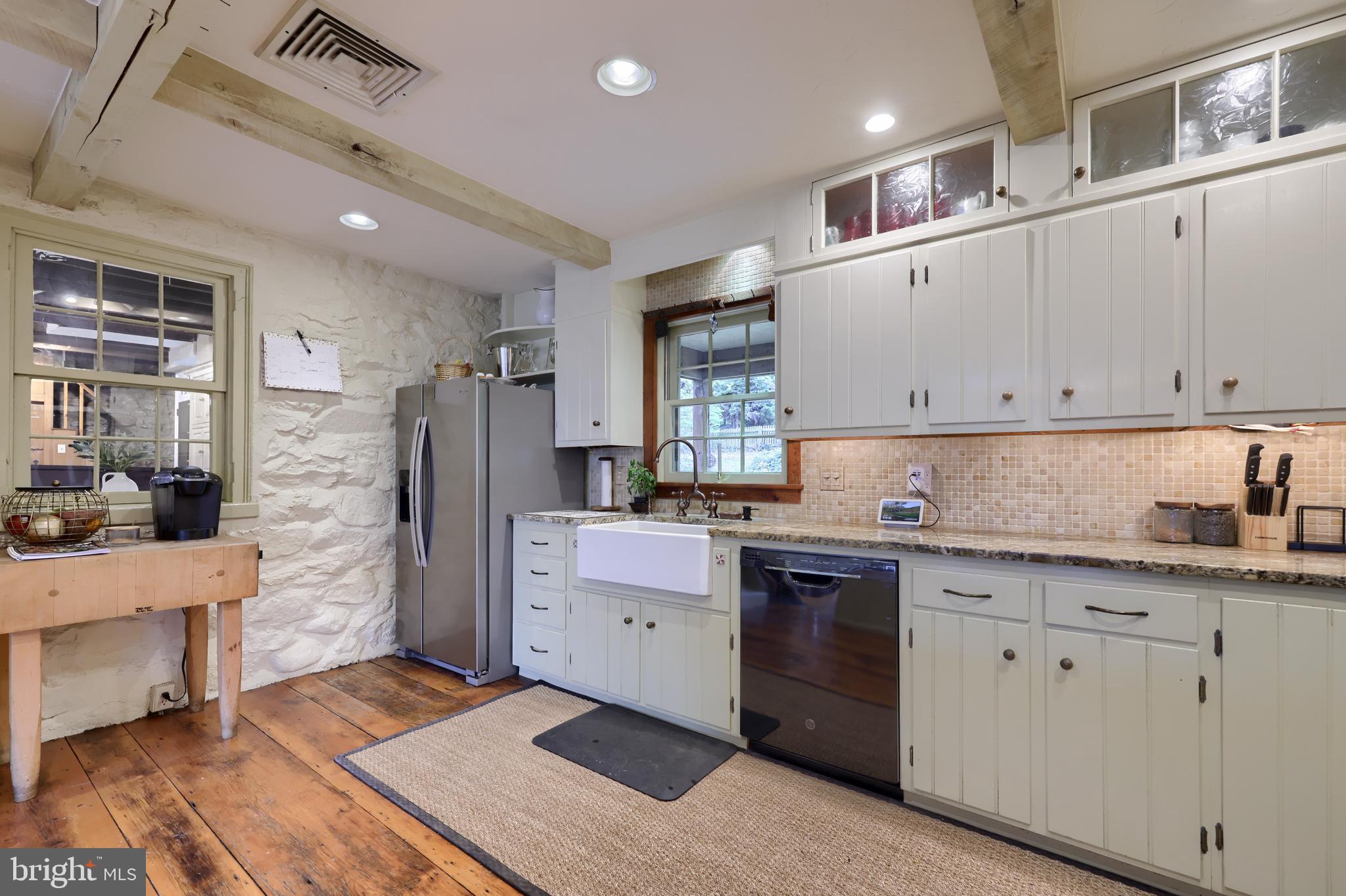 705 Schoffers Road Birdsboro, PA 19508 - Photo 55 of 106 a kitchen with cabinets and wooden floor