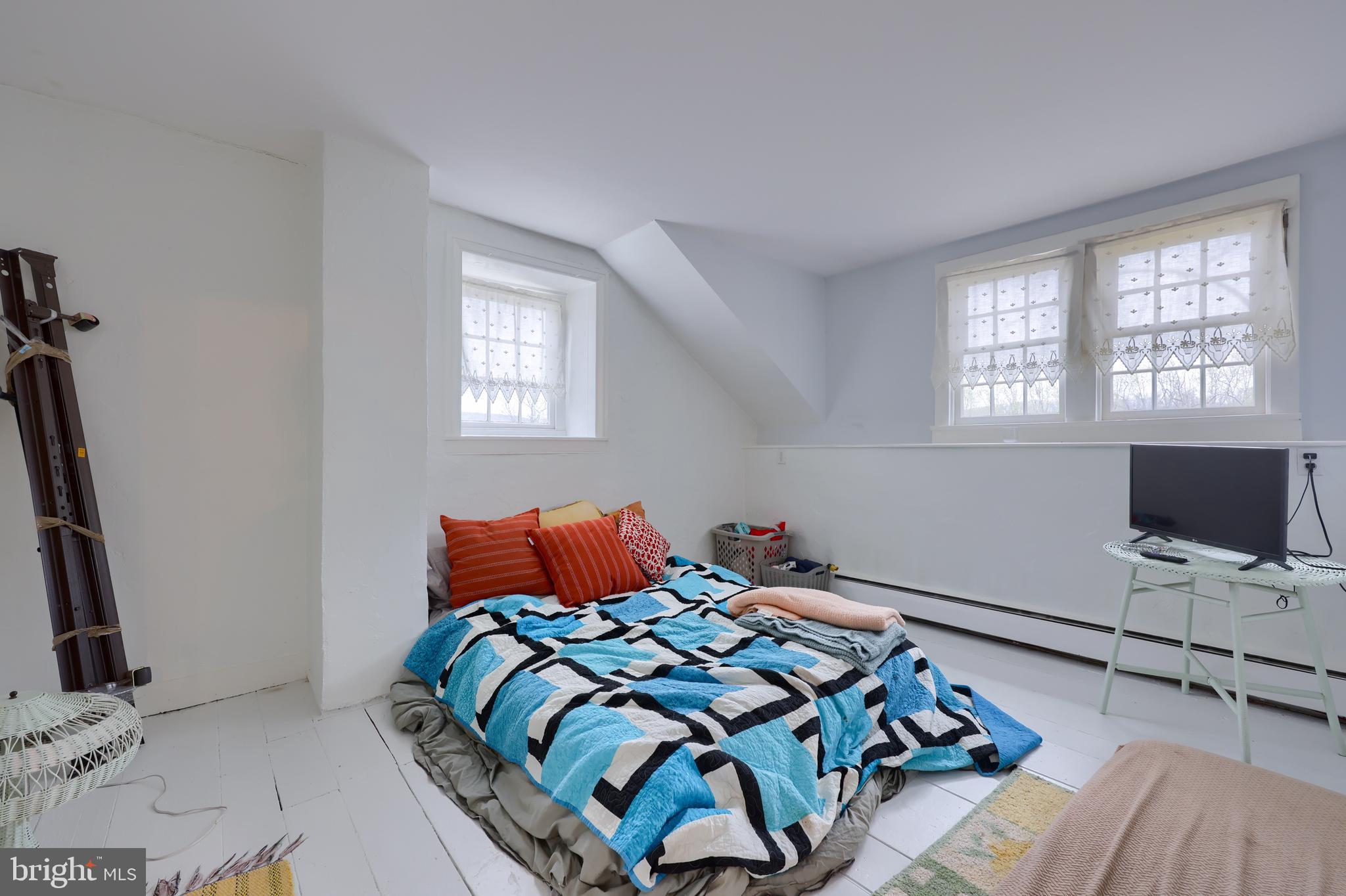 705 Schoffers Road Birdsboro, PA 19508 - Photo 82 of 106 a bedroom with a bed and flat screen tv