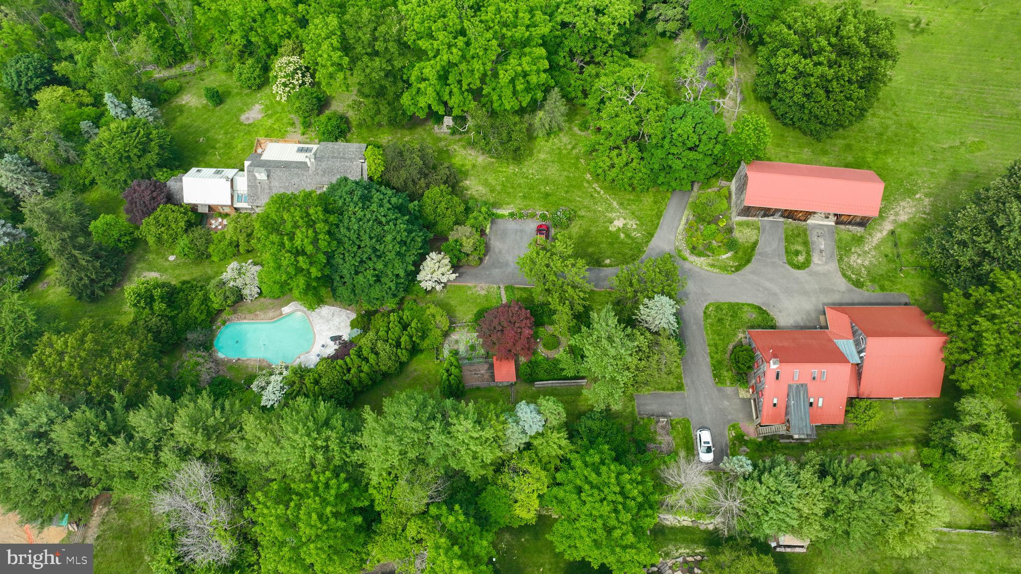 705 Schoffers Road Birdsboro, PA 19508 - Photo 9 of 106 an aerial view of a house with a yard and lake view