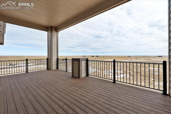 a view of a balcony with wooden floor