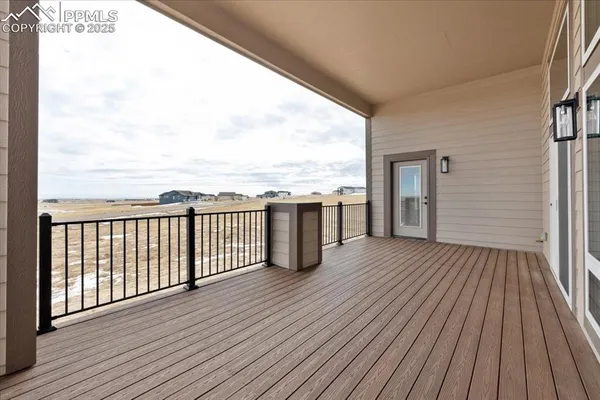 a view of a balcony with wooden floor