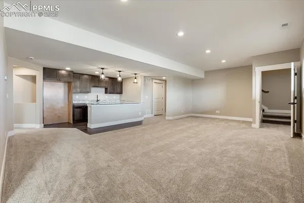 a big room with closet and windows