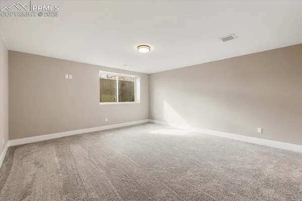 a view of a big room with windows and cabinet