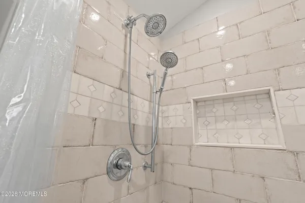 a bedroom with a bed and a television