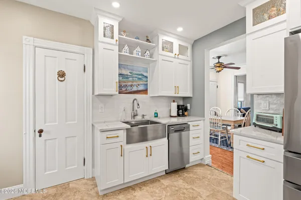 a kitchen with a stove a sink and a microwave