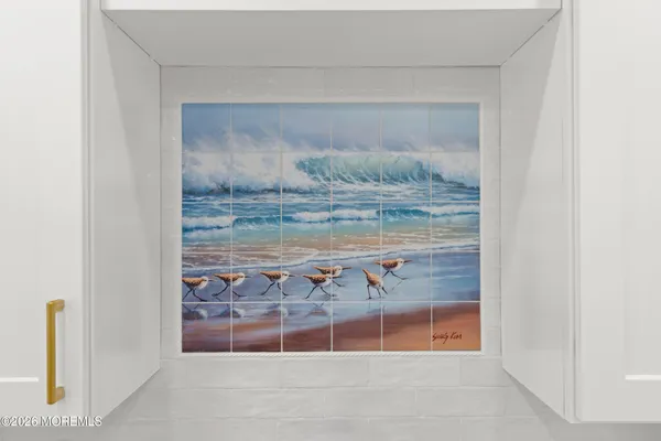 a bathroom with a sink toilet and a mirror