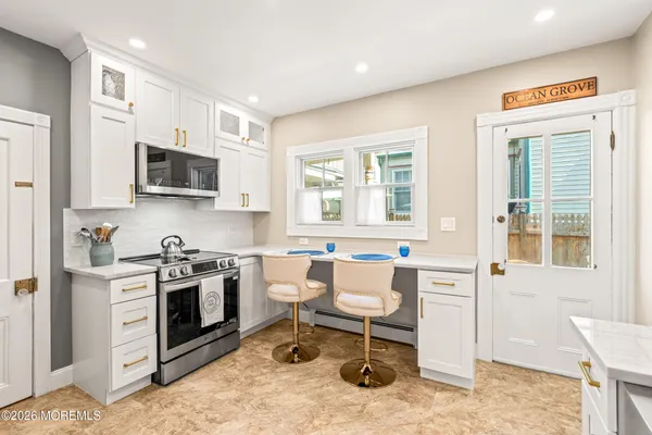 a bathroom with a sink a mirror and shower