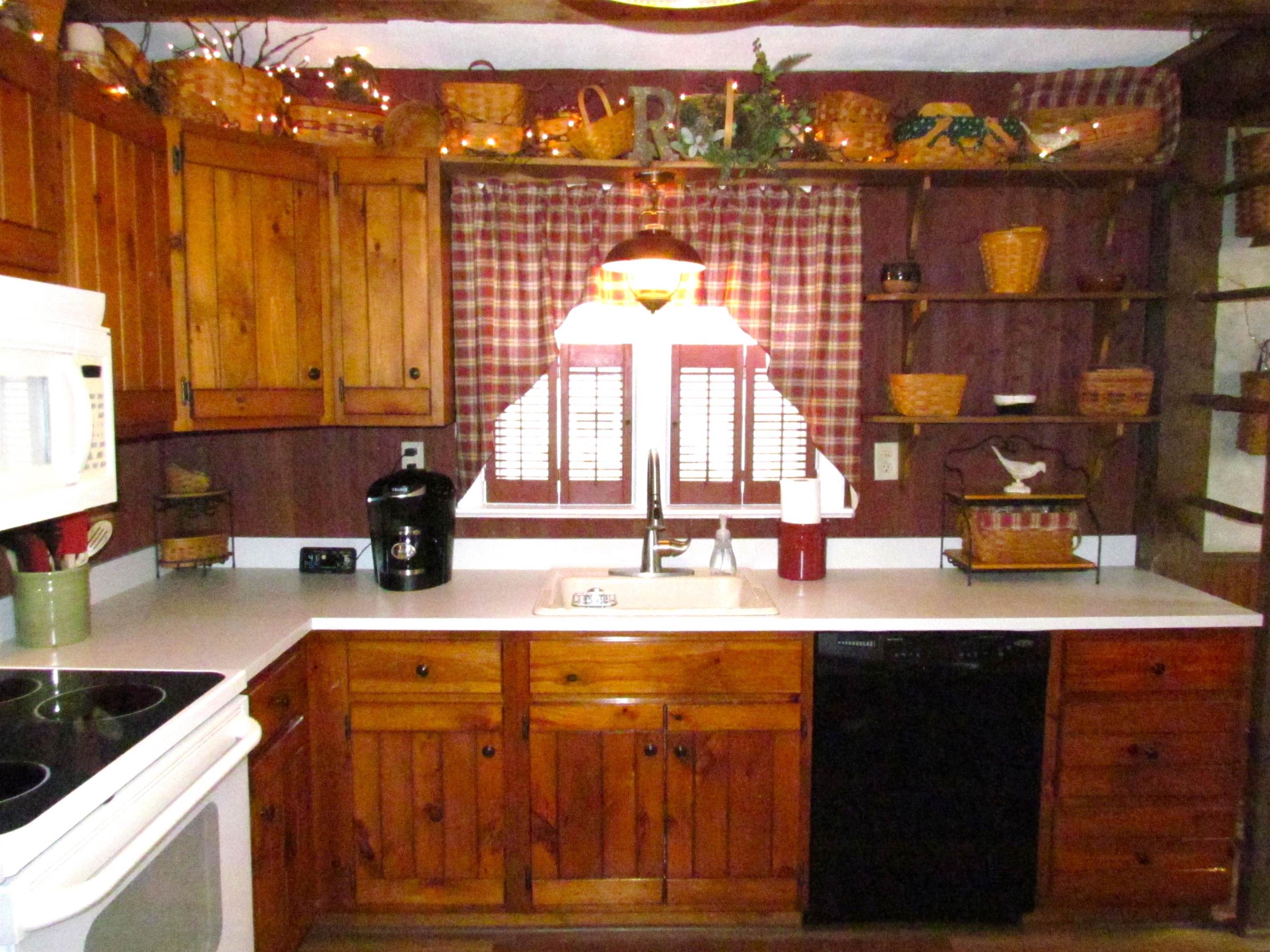 727 Elgin Street Cherry Valley, IL 61016 - Photo 11 of 35 a kitchen with a sink and a stove top oven