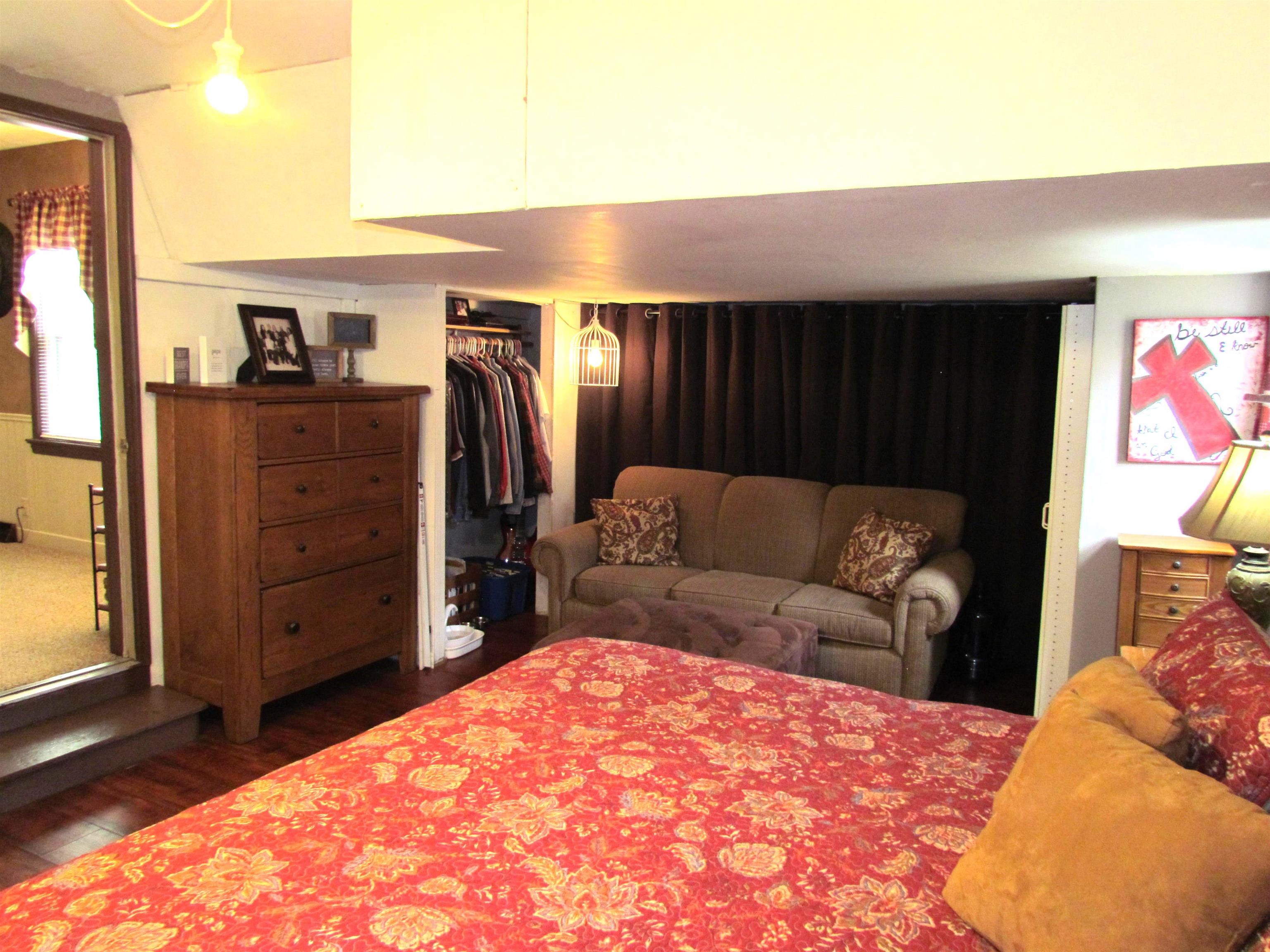 727 Elgin Street Cherry Valley, IL 61016 - Photo 23 of 35 a living room with furniture a walk in closet
