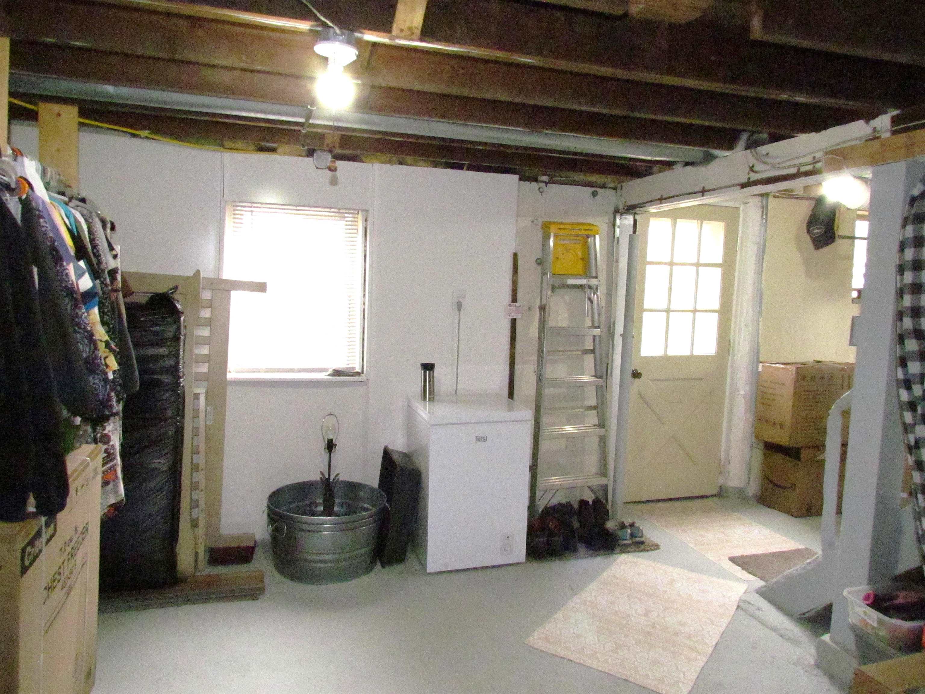 727 Elgin Street Cherry Valley, IL 61016 - Photo 27 of 35 a room with water heater and windows