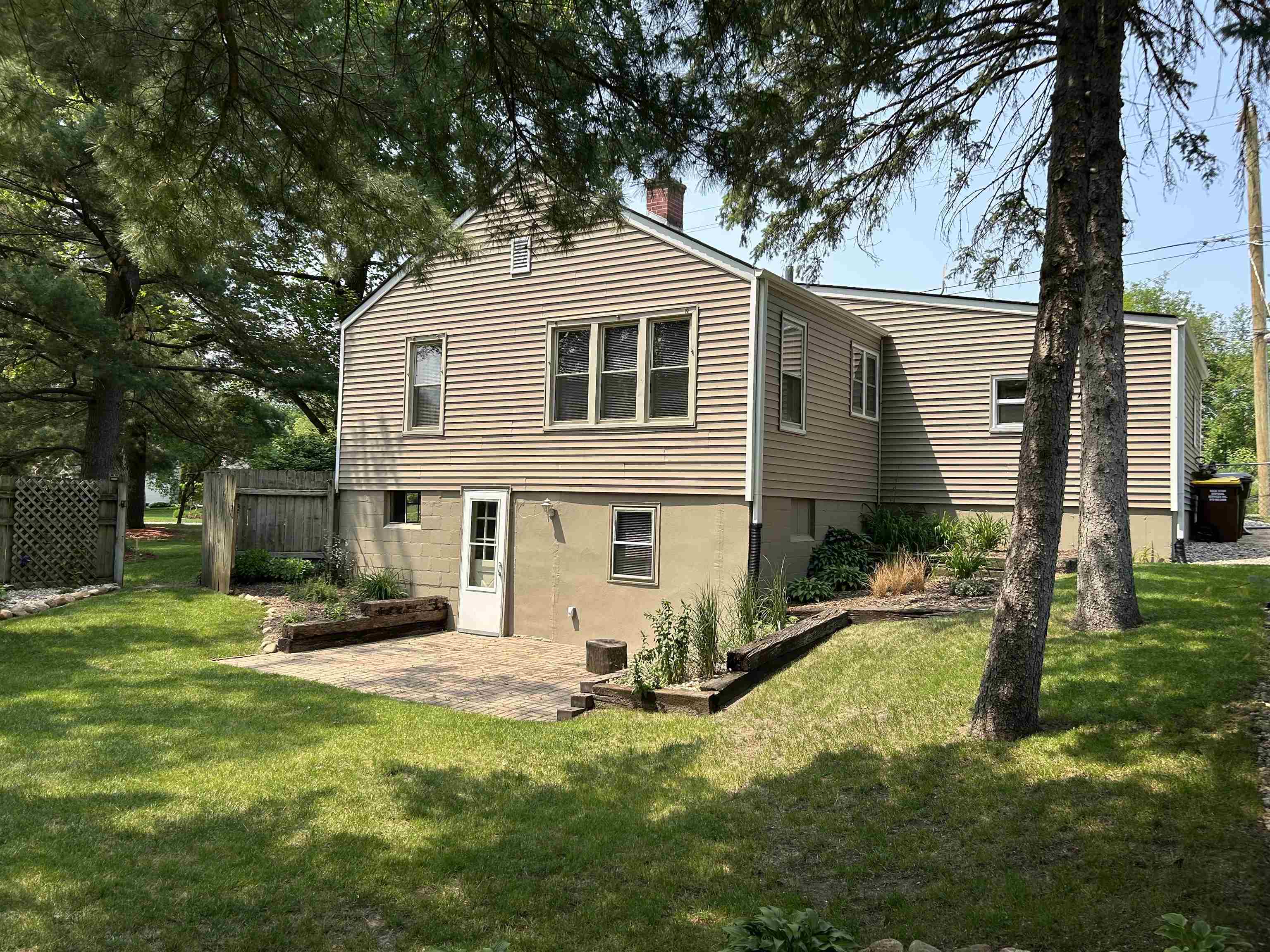727 Elgin Street Cherry Valley, IL 61016 - Photo 3 of 35 a front view of house with yard and trees in the background