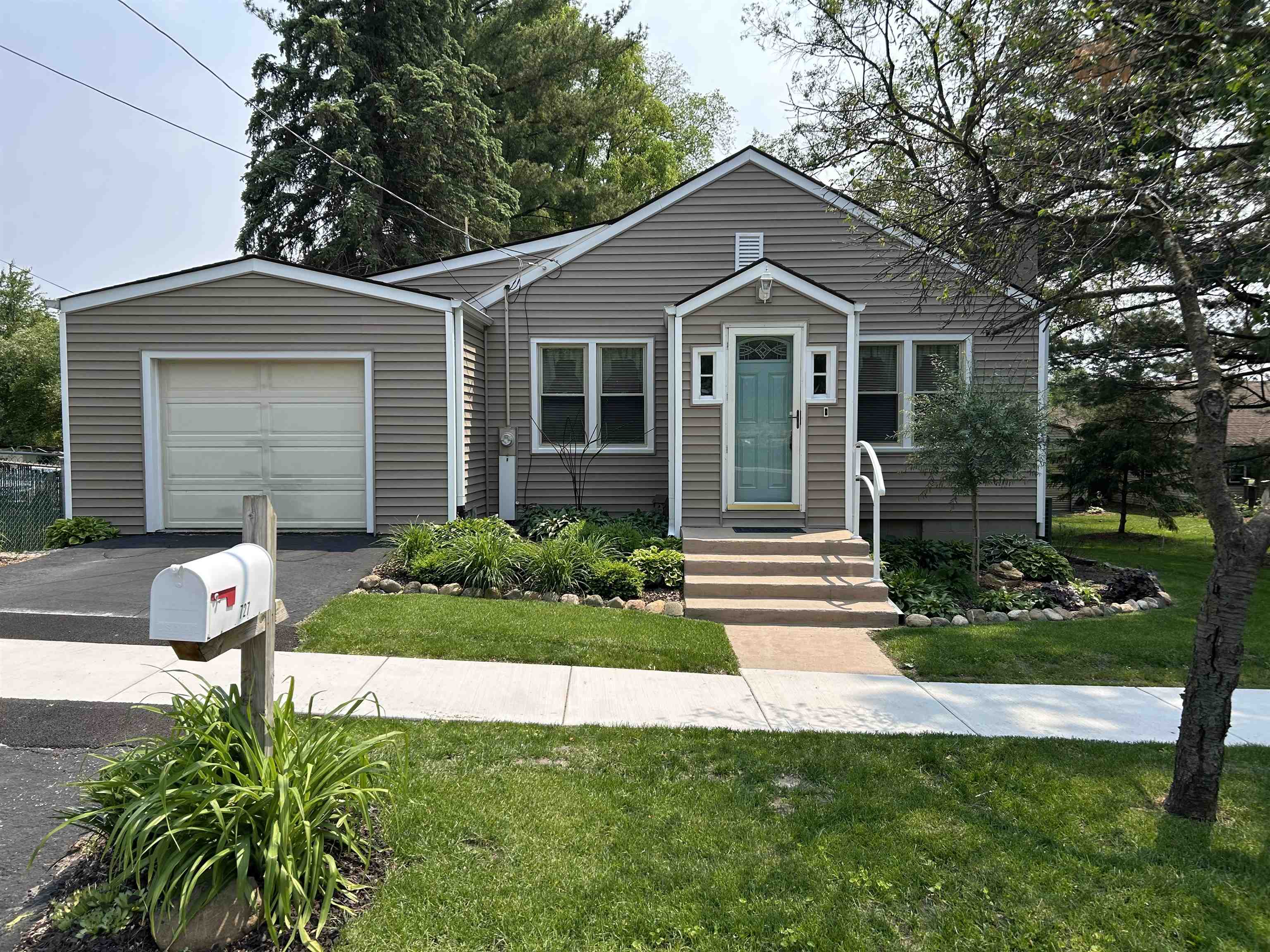 727 Elgin Street Cherry Valley, IL 61016 - Photo 35 of 35 a front view of a house with a yard