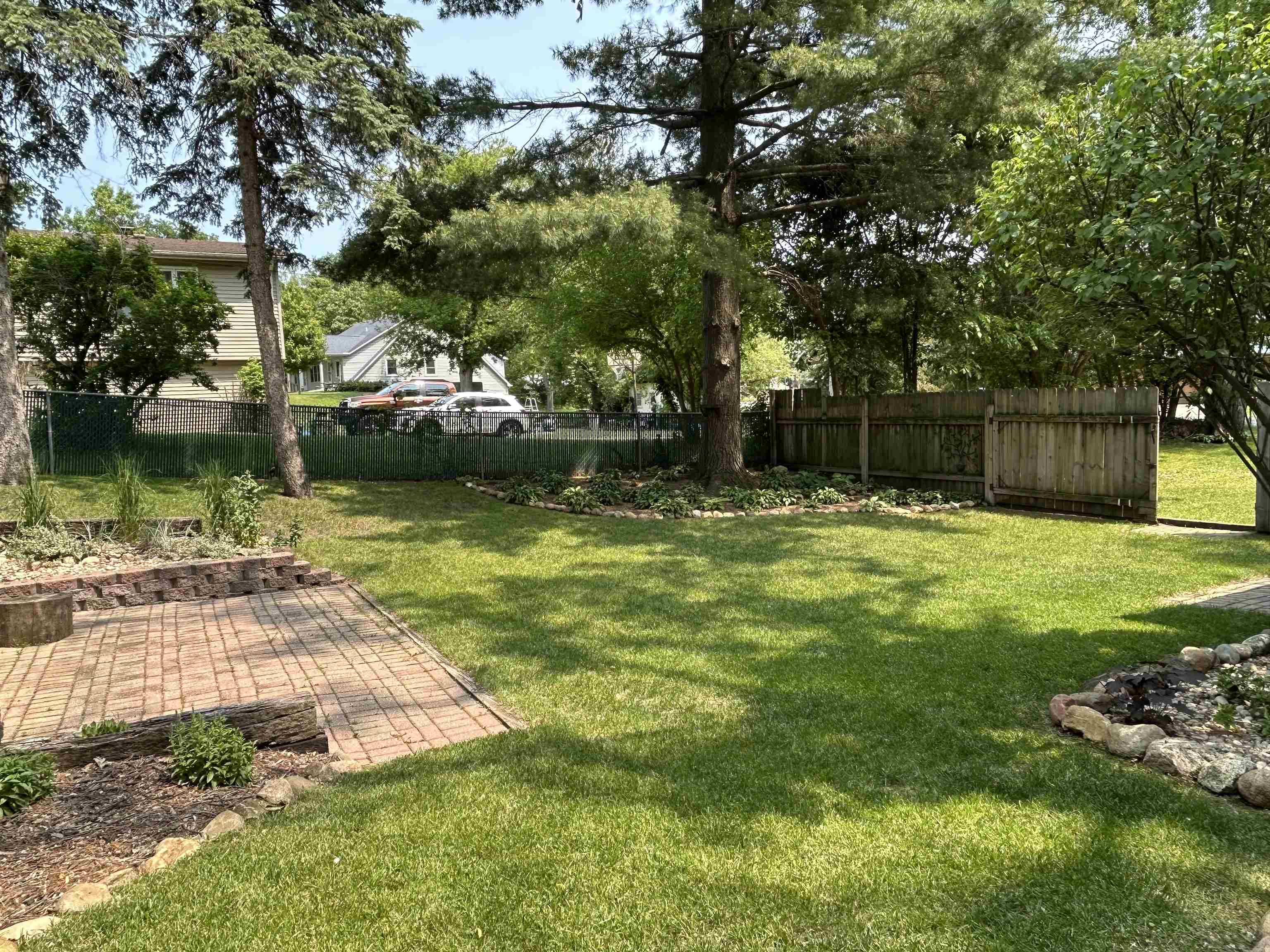 727 Elgin Street Cherry Valley, IL 61016 - Photo 5 of 35 a swimming pool with wooden fence