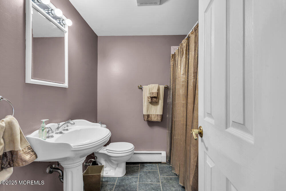 16 Davey Jones Way Waretown, NJ 08758 - Photo 11 of 21 a bathroom with a sink toilet and a mirror