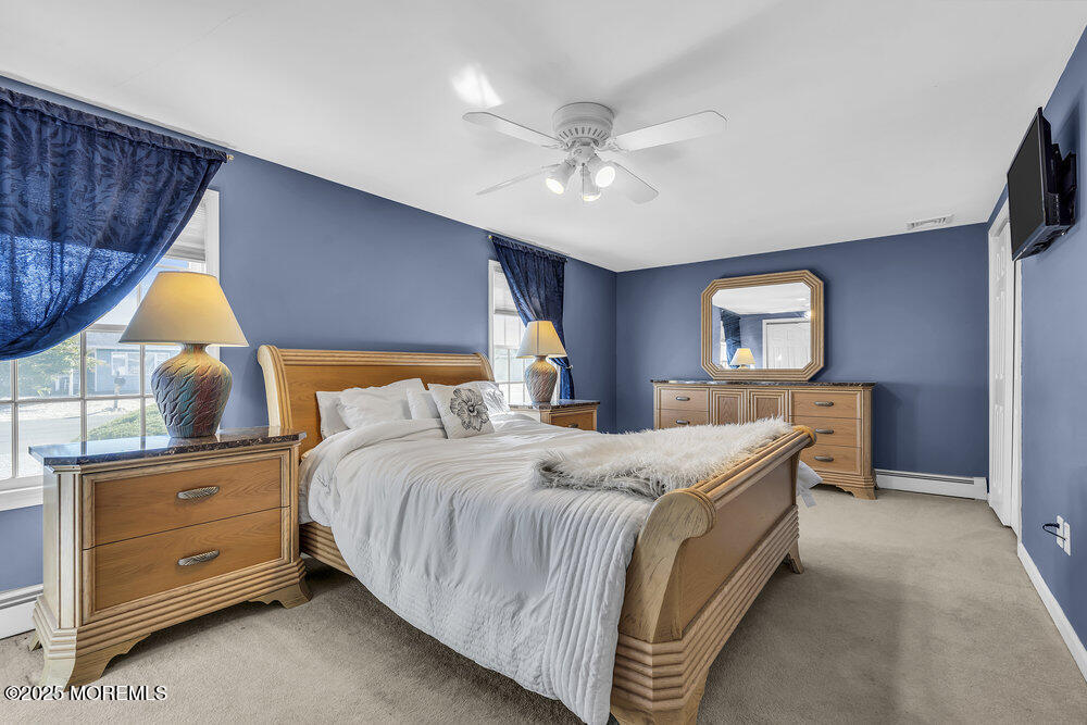 16 Davey Jones Way Waretown, NJ 08758 - Photo 13 of 21 a bed room with a bed and a mirror