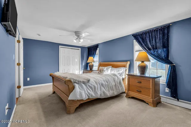 a view of a house with cars parked in front of it