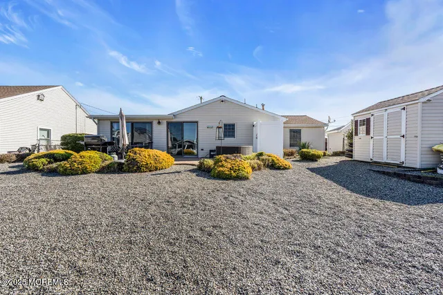 a bedroom with bed and window