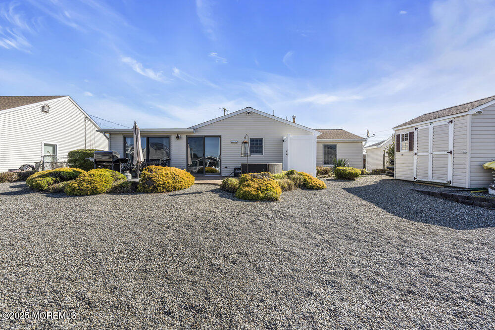 16 Davey Jones Way Waretown, NJ 08758 - Photo 15 of 21 a view of a house with cars parked in front of it