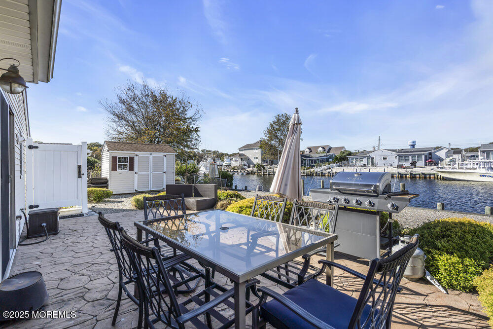 16 Davey Jones Way Waretown, NJ 08758 - Photo 17 of 21 a view of a terrace with furniture and stove