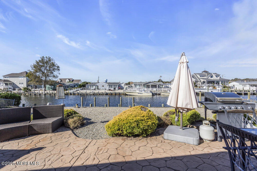 16 Davey Jones Way Waretown, NJ 08758 - Photo 19 of 21 a view of a terrace with furniture and city view