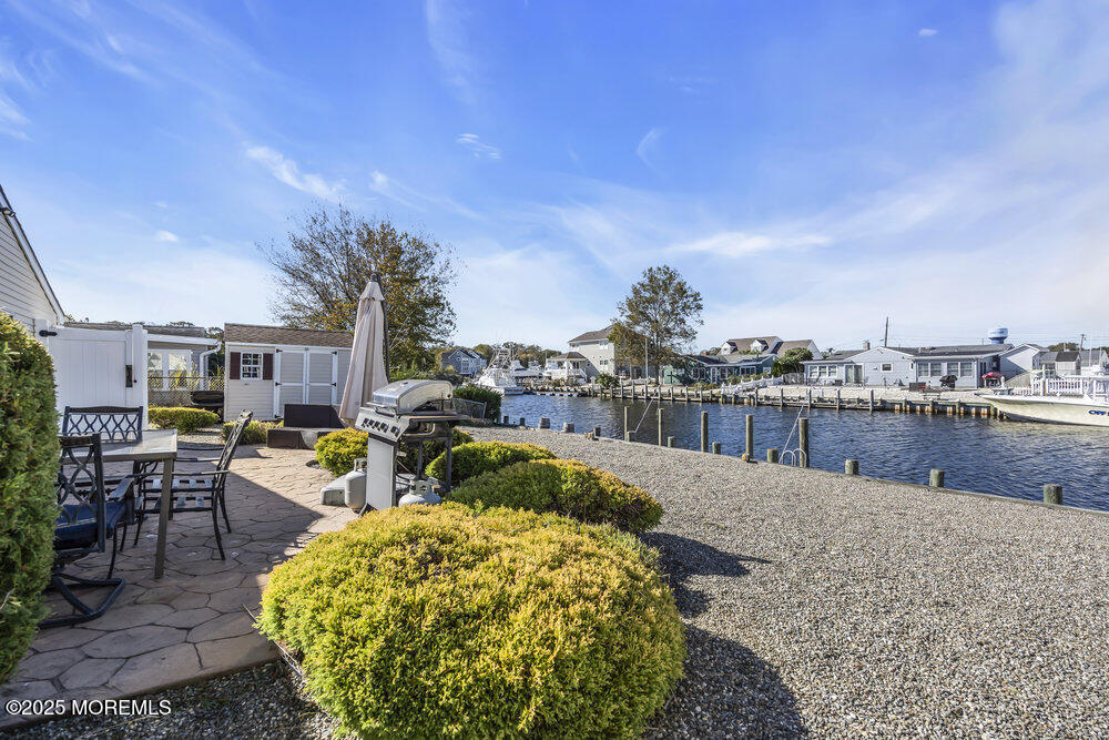 16 Davey Jones Way Waretown, NJ 08758 - Photo 20 of 21 a swimming pool with outdoor seating and yard