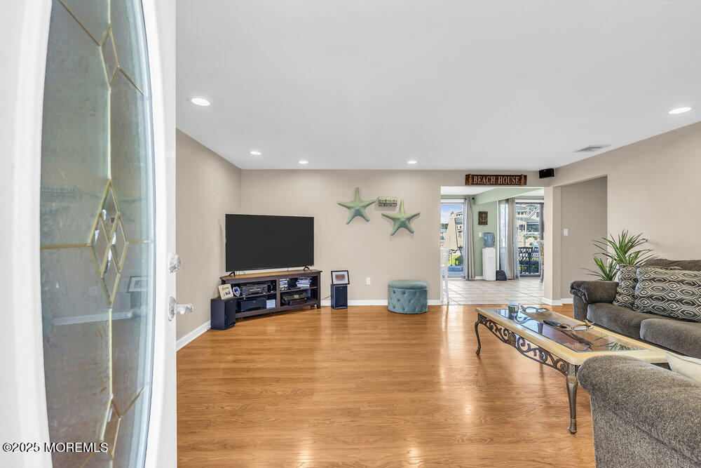 16 Davey Jones Way Waretown, NJ 08758 - Photo 2 of 21 a living room with furniture and a flat screen tv