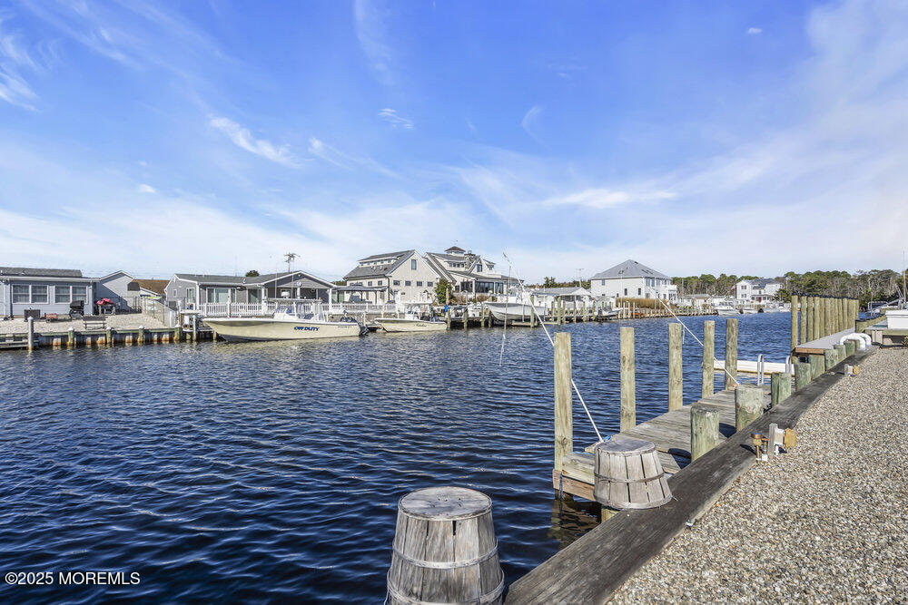 16 Davey Jones Way Waretown, NJ 08758 - Photo 21 of 21 a view of roof deck with outdoor seating and city view