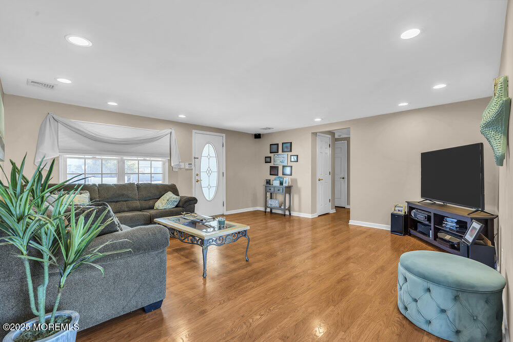 16 Davey Jones Way Waretown, NJ 08758 - Photo 4 of 21 a living room with furniture and a flat screen tv