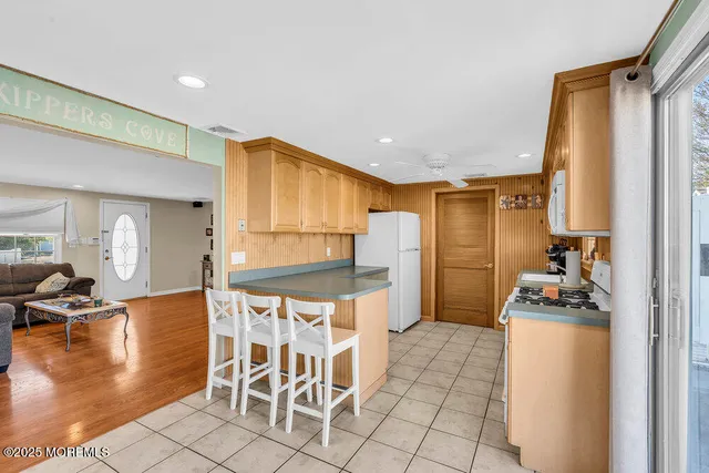 a kitchen with a sink cabinets and window