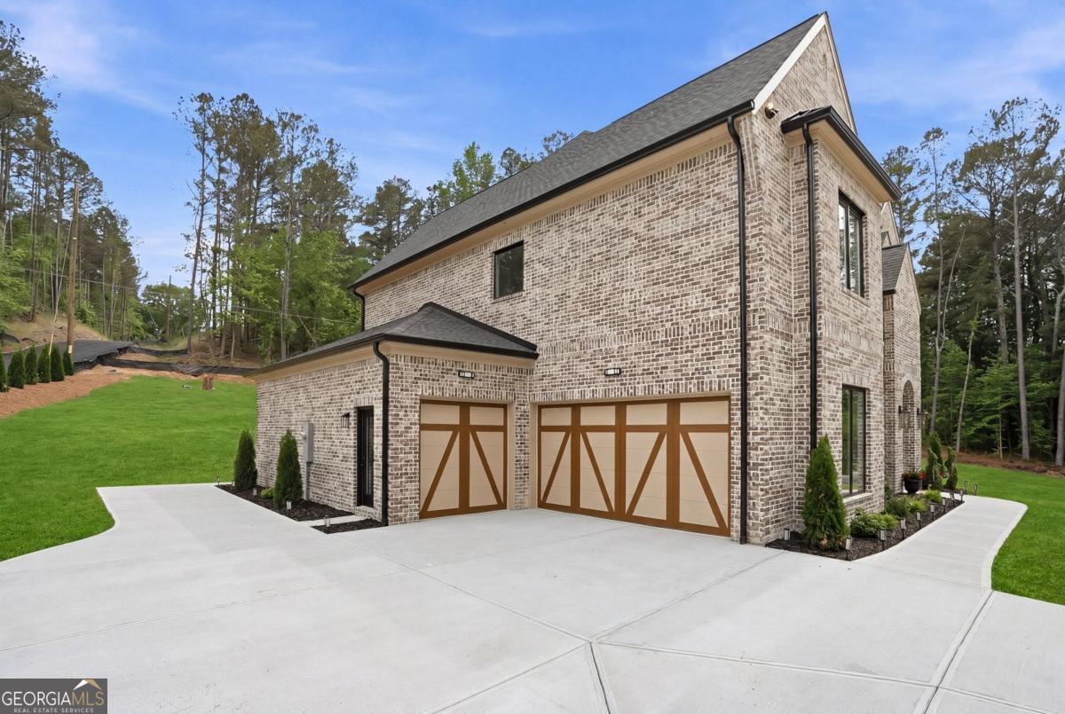1557 Whitley Road Dacula, GA 30019 - Photo 42 of 46 a view of a house with backyard and trees