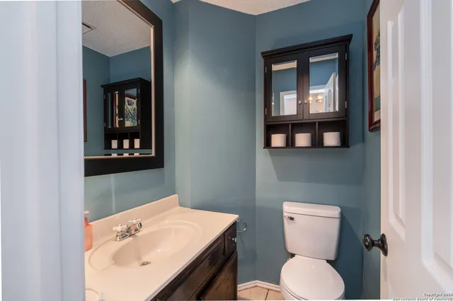 a view of storage and utility room with wooden floor