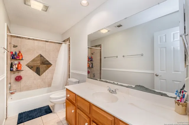 a bedroom with a bed and a television