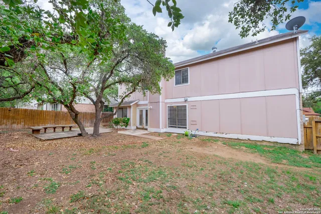 a front view of a house with a yard and a garage