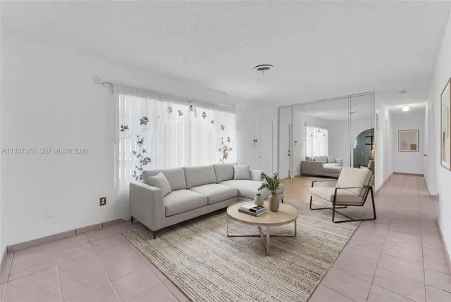 a living room with furniture and a table