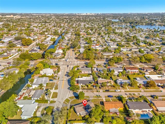 an aerial view of residential building with parking space