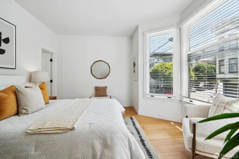 a bedroom with a bed and window