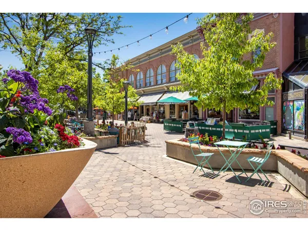 a group of people sitting in front of a building