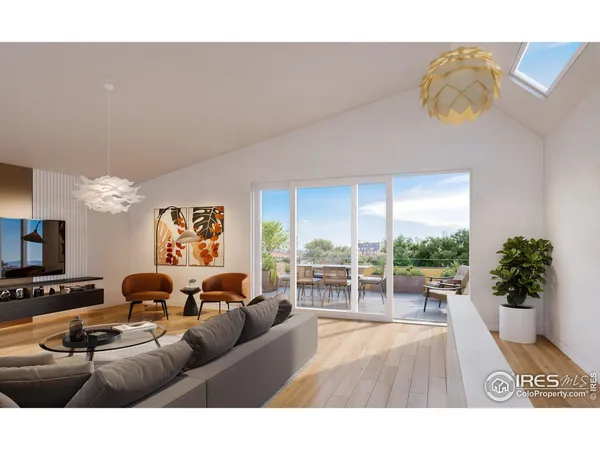 a living room with furniture potted plant and a large window