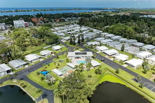 an aerial view of a swimming pool with outdoor space