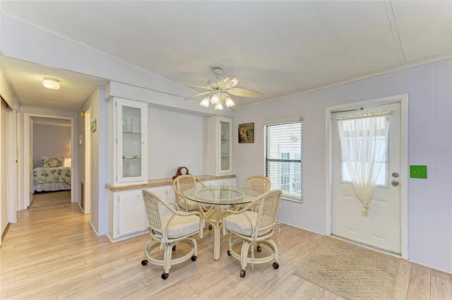 a dining room with furniture and window