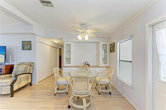 a view of a dining room with furniture and wooden floor