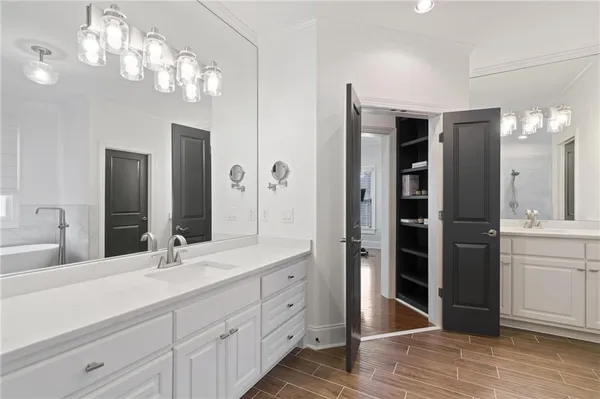 a living room with furniture a rug and a chandelier