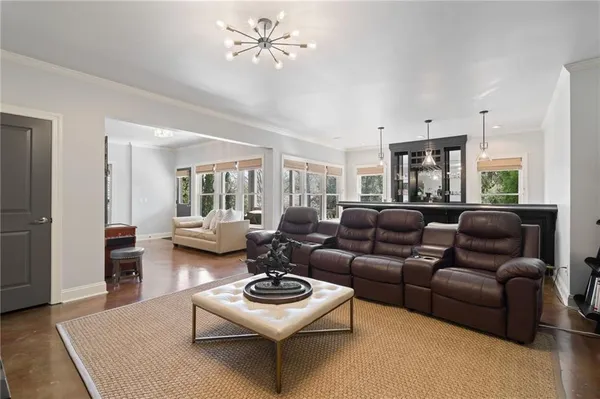 a view of a dining table chairs and chandelier