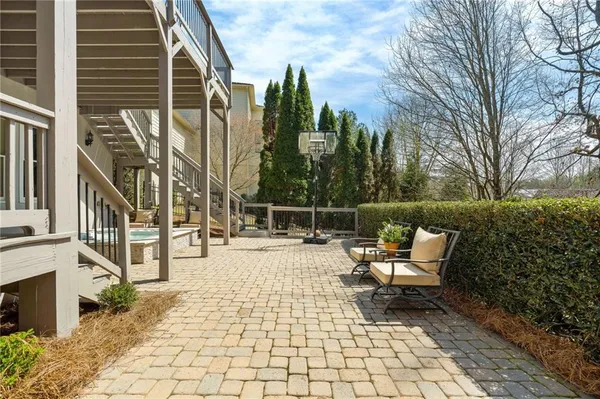 a view of yard with tree in front of it
