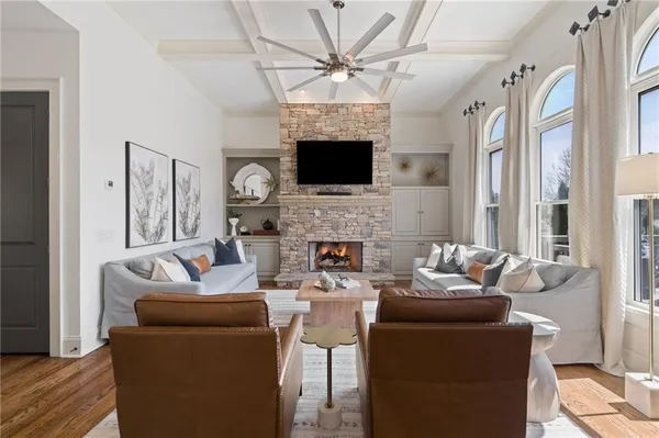 a living room with furniture fireplace and flat screen tv