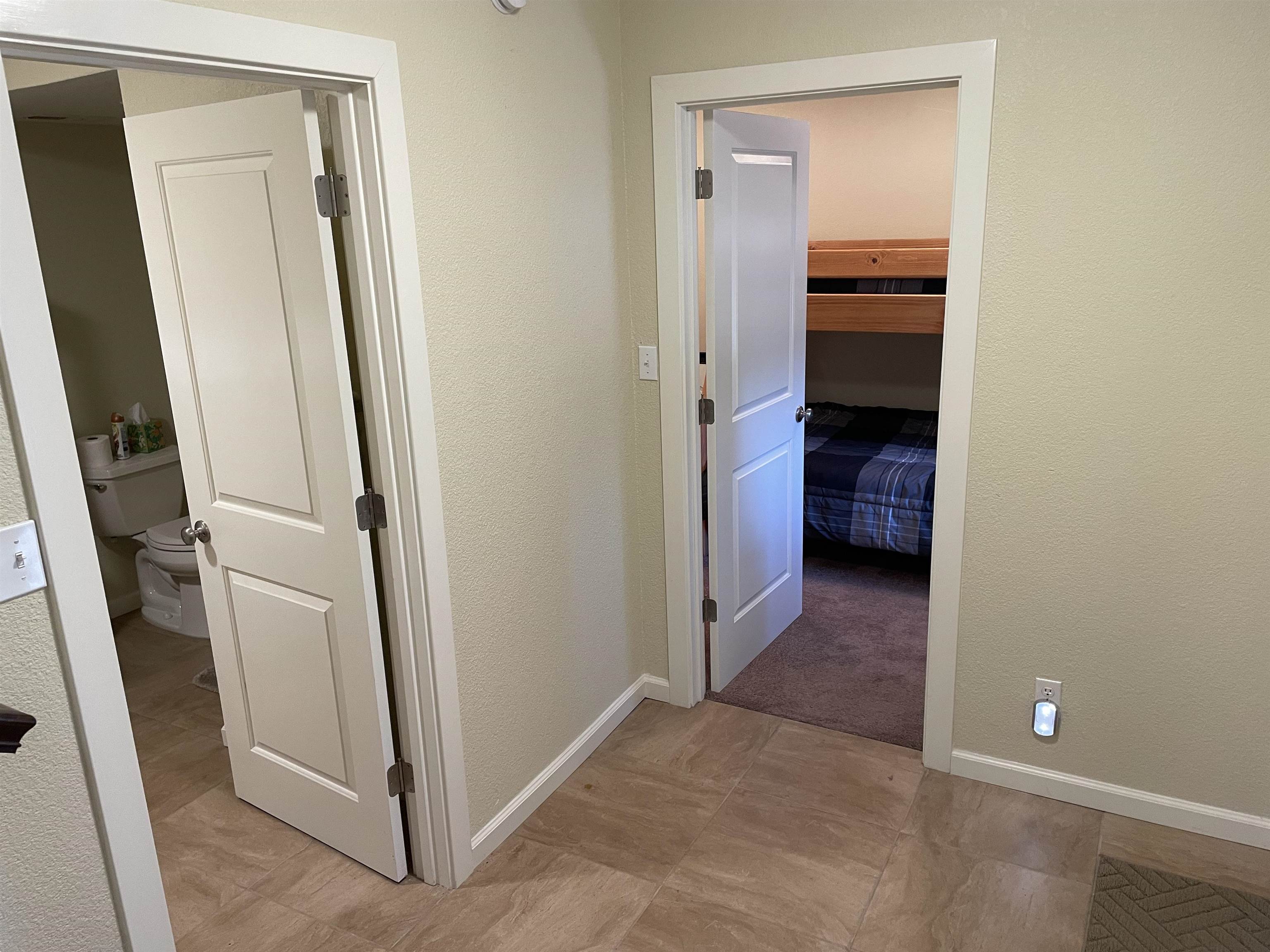 831 Timber Ridge Road Lake Almanor, CA 96137 - Photo 26 of 36 a view of a kitchen from a hallway