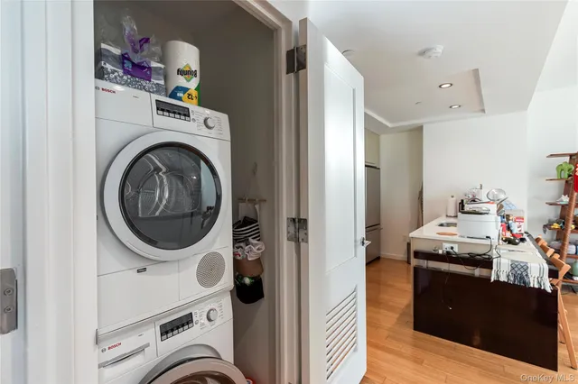 a view of a storage and utility room with a washer dryer