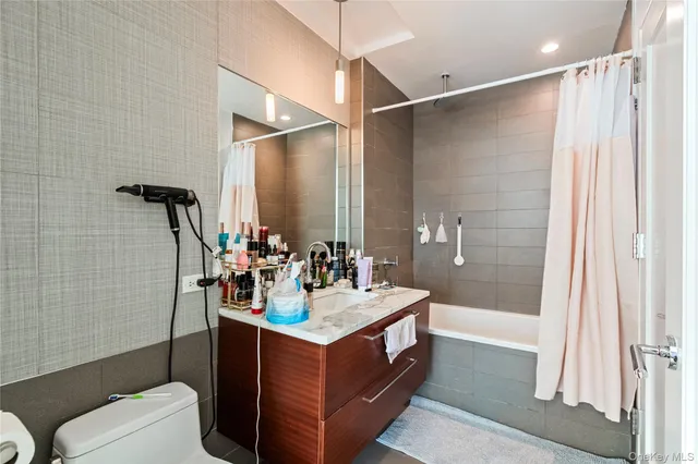 a bathroom with a sink double vanity and a mirror