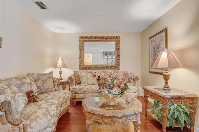 a spacious bathroom with a tub sink and mirror